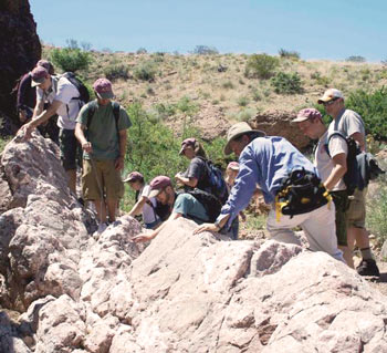 Students examine a fault scarp