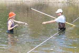 Decorative image showing students conducting stream studies.