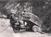 Navajo miners near Cove, Arizona, dump tailings over the side of a mesa in 1952.