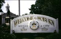 A sign reading "Welcome to Woburn"