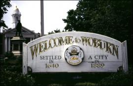 A sign reading "Welcome to Woburn"